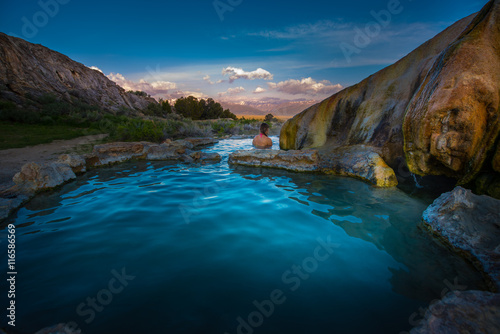 Woman relaxes in Travertine Hot Springs California USA