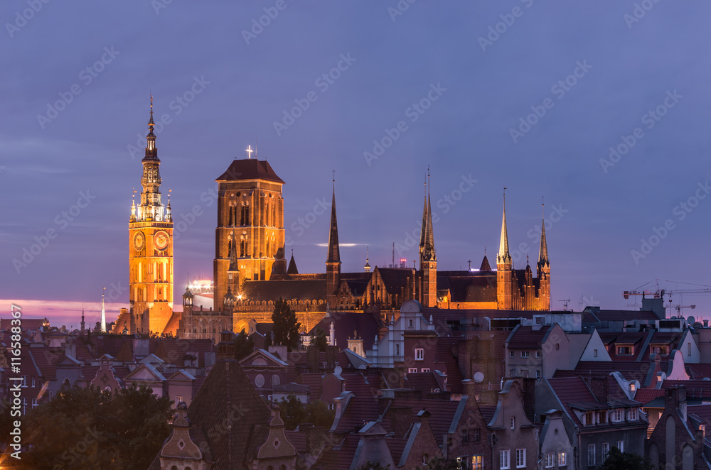 Historical center of Gdansk, town hall and St. Mary's Church illuminated at night