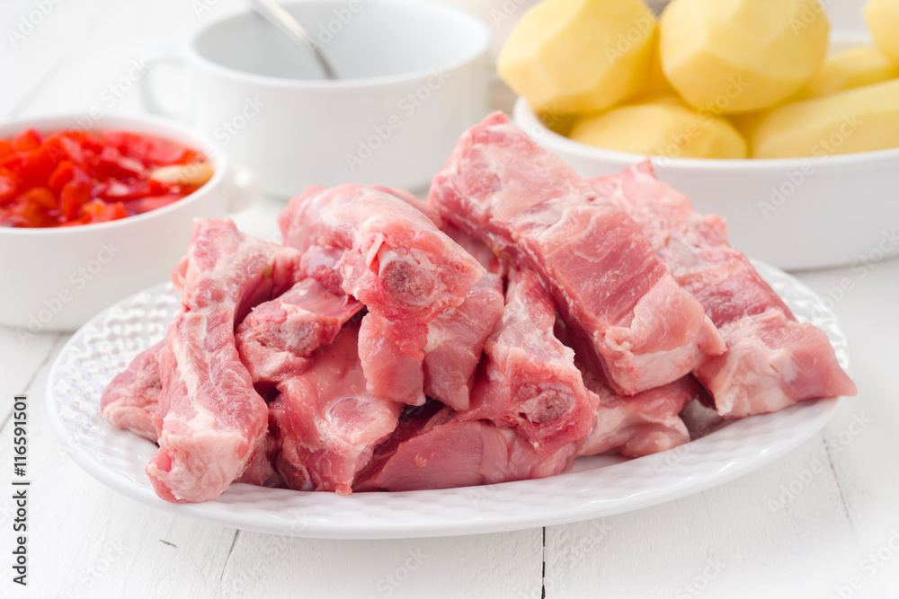 rib pork sliced and peeled potatoes in earthenware rib pork sliced and peeled potatoes in earthenware