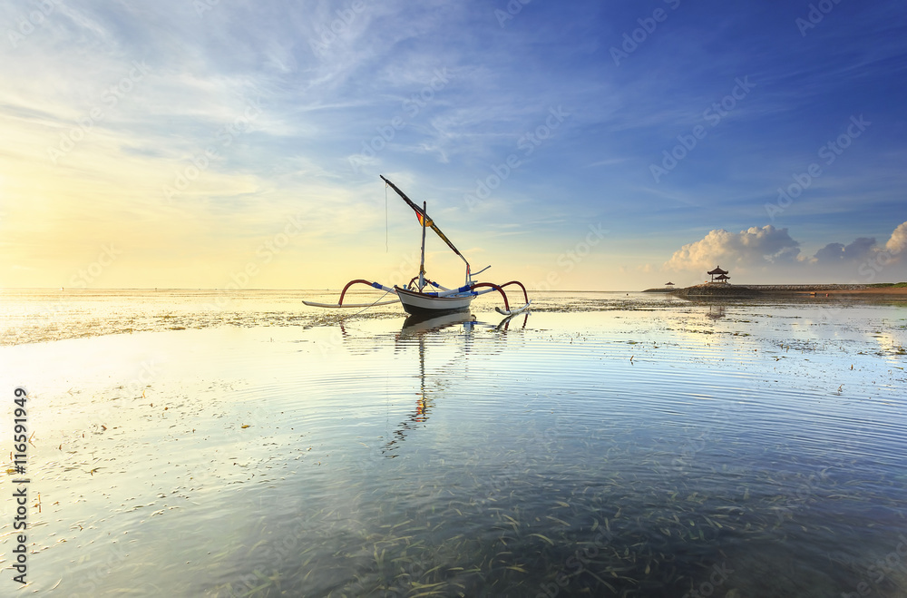 Bali, Indonesia. Fishing boats populate the shoreline at the Sanur beach