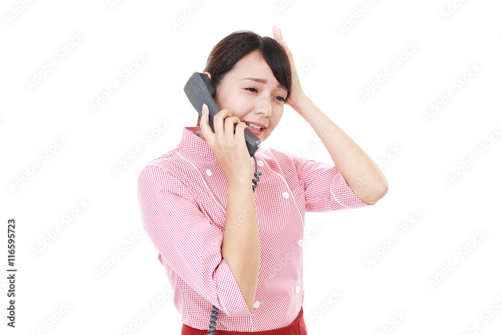 受話器を持つウェイトレス 受話器を持つウェイトレス