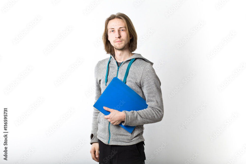 Portrait of young man with long blond hair on a white background Portrait of young man with long blond hair on a white background