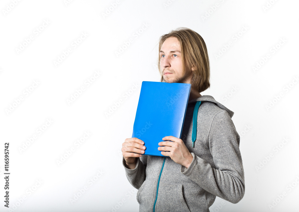 Portrait of young man with long blond hair on a white background