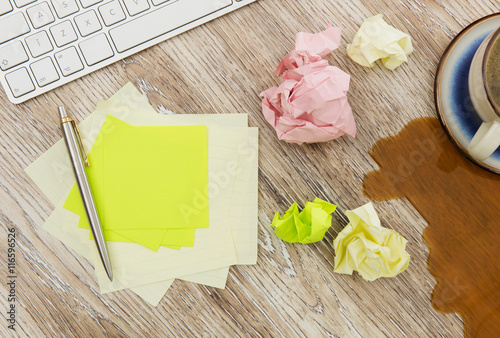 Adhesive note on messy desk