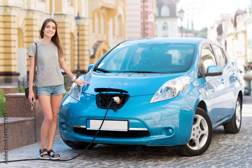 Woman ready to go on electric vehicle © zinkevych