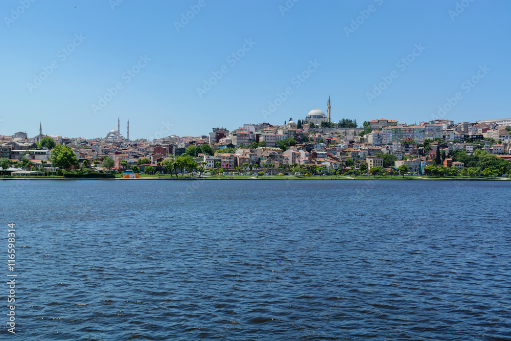 distant shore of Istanbul with hills and houses. with sea view.