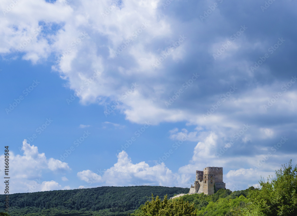 Landscape Image, Ruins of a castle in Csesznek, Veszprem, Hungary with Blue Sky and Clouds