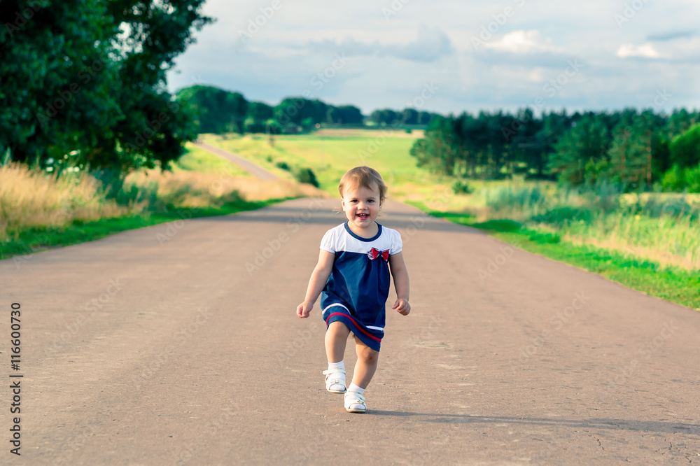 Little Girl Rushing little girl in ress running towards the road and laughs Stock Photo ...