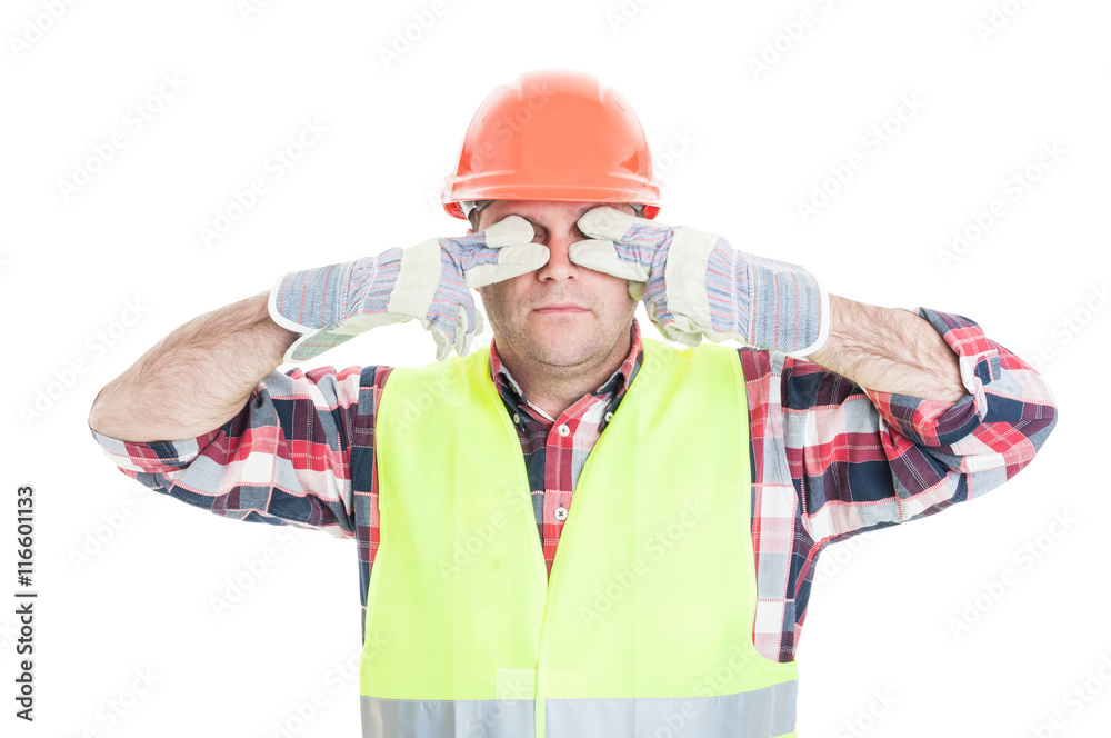 Male builder making the see no evil gesture Male builder making the see no evil gesture