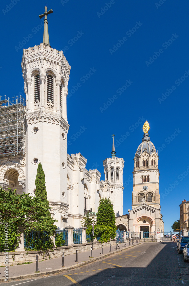 Lyon, France. Basilica of Notre-Dame de Fourvière and tower-chapel with a statue of the Virgin Mary (right). Included in the list of UNESCO