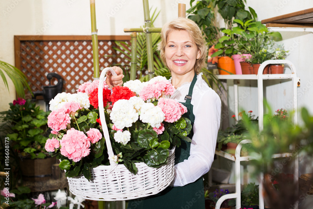 Florist having a basket with hydrangea