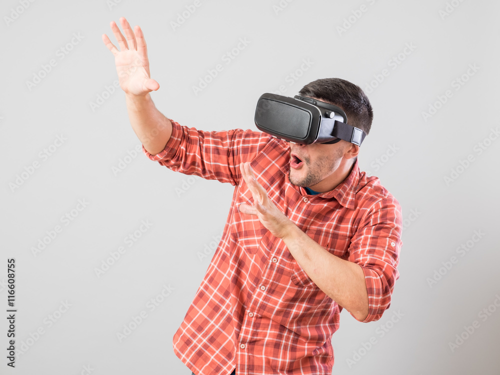 Man with virtual reality glasses showing gesture Man with virtual reality glasses showing gesture