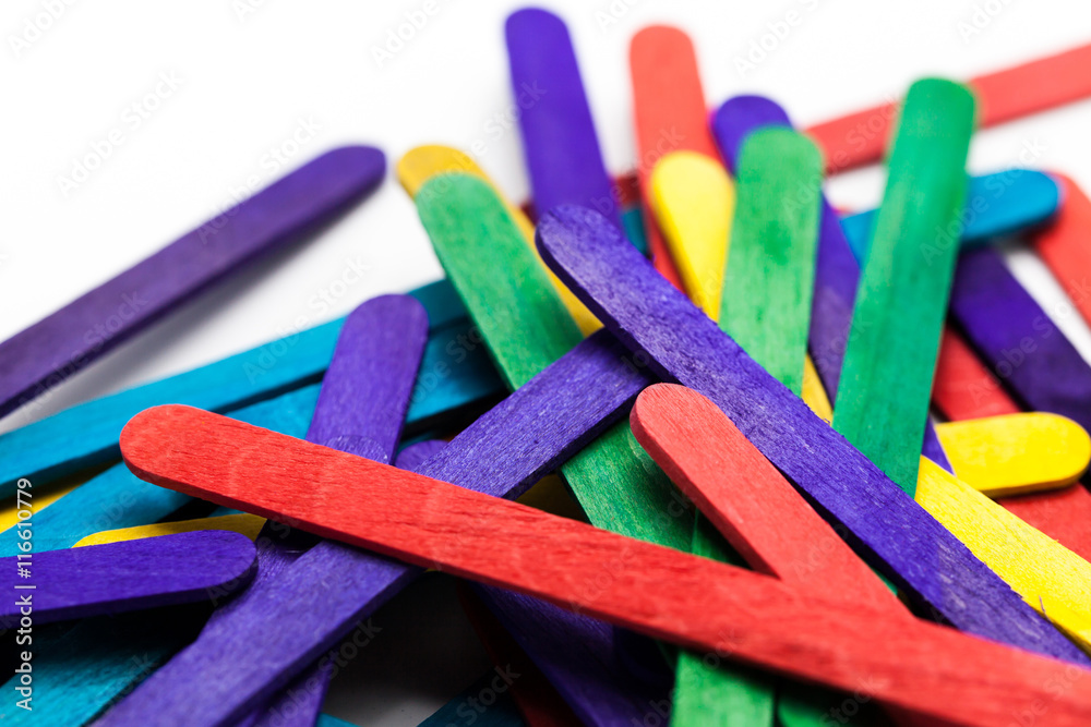 Colorful Popsicle Sticks Over White Background (Shallow Depth Of