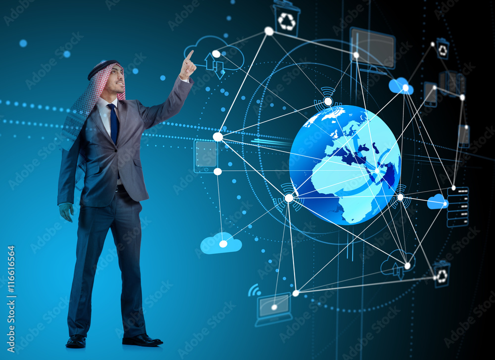 Arab man pressing dots on world map in global communication conc Arab man pressing dots on world map in global communication conc