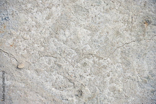 Gray cracked concrete texture background, close up