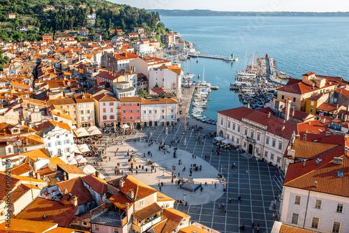 Beautiful aerial view on Piran town with Tartini main square, ancient buildings with red roofs and Adriatic sea in southwestern Slovenia