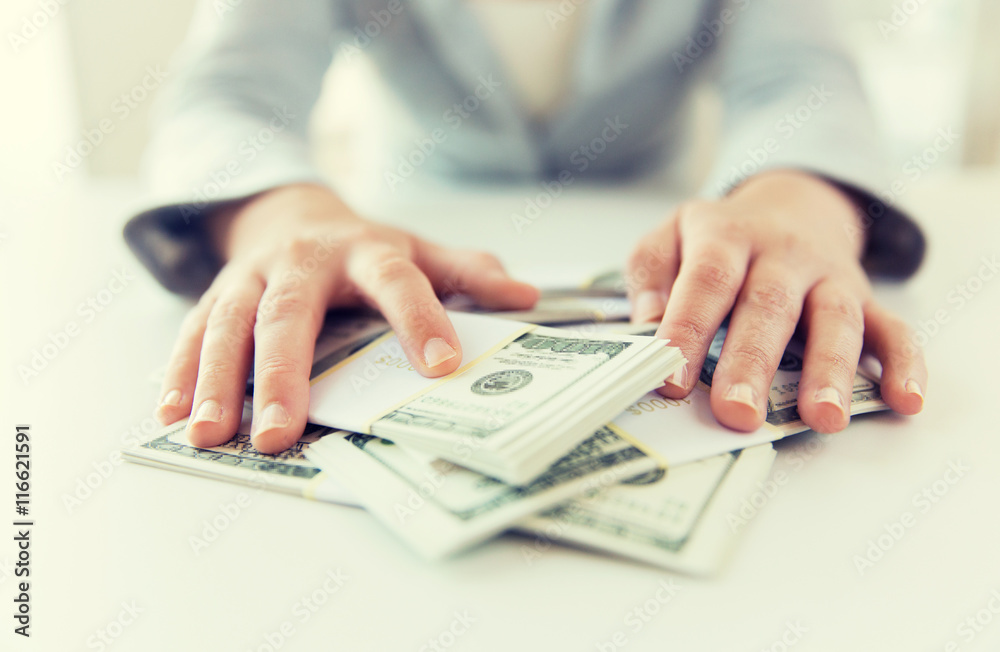 close up of woman hands counting us dollar money close up of woman hands counting us dollar money