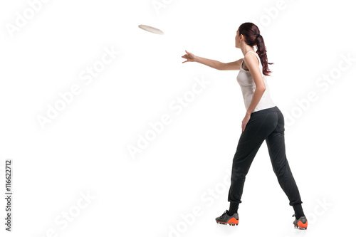 young happy woman playing with flying disc
