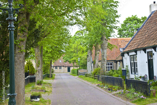 View of typical historic street in Ameland, The Netherlands photo