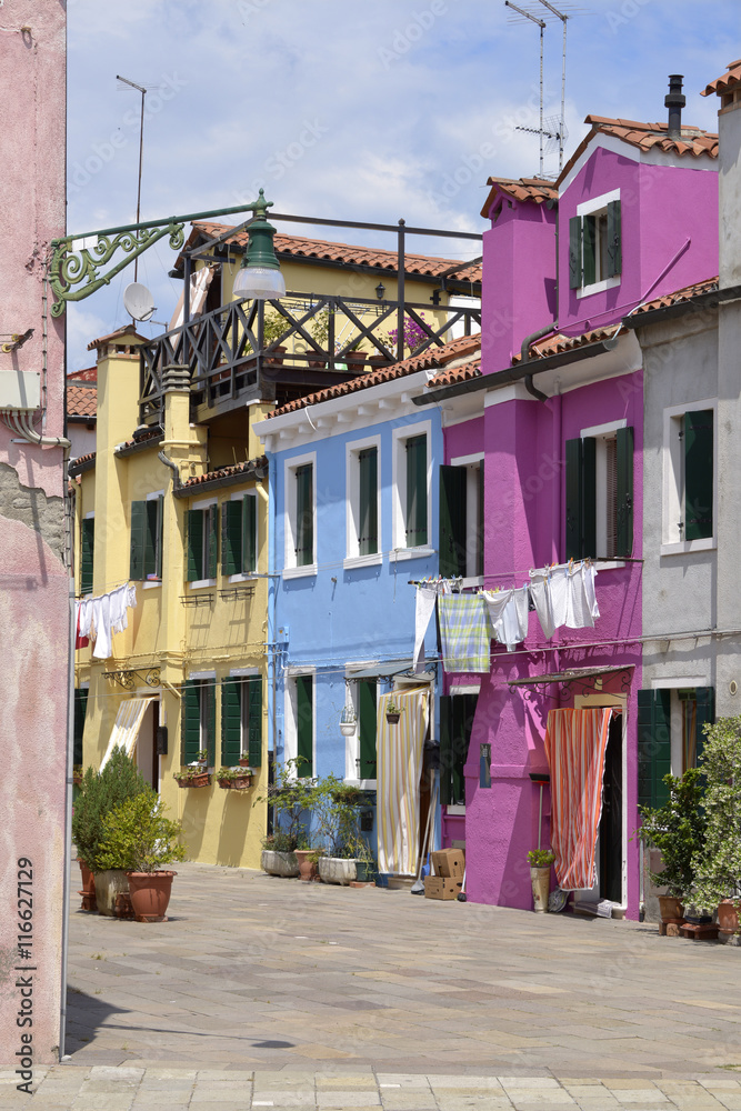 Obraz premium Burano is an island in the Venetian Lagoon, northern Italy. Burano is known for its small, brightly painted houses,which are popular with artists. Burano is also known for its lace