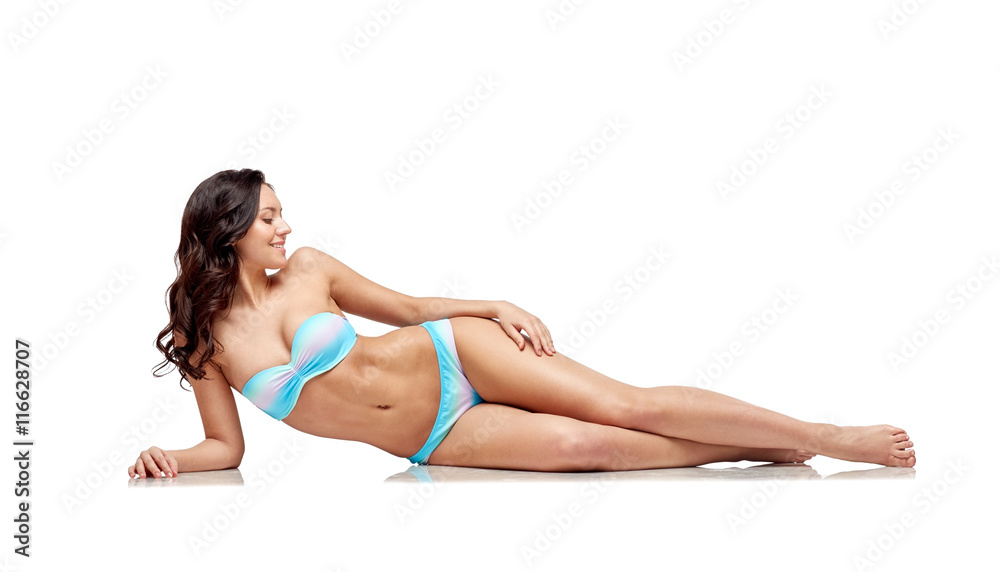 happy young woman lying in bikini swimsuit