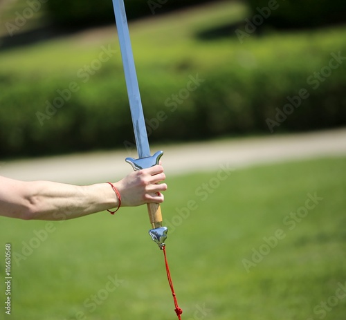 hand of the master of martial arts Tai Chi with the sword during © ChiccoDodiFC