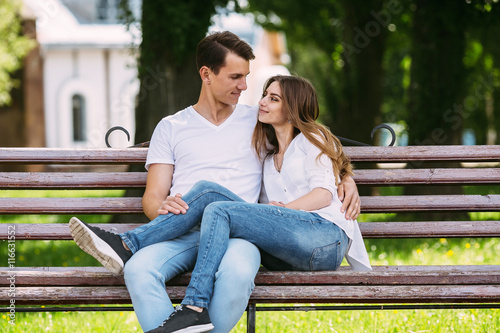 man and woman on a bench in the park