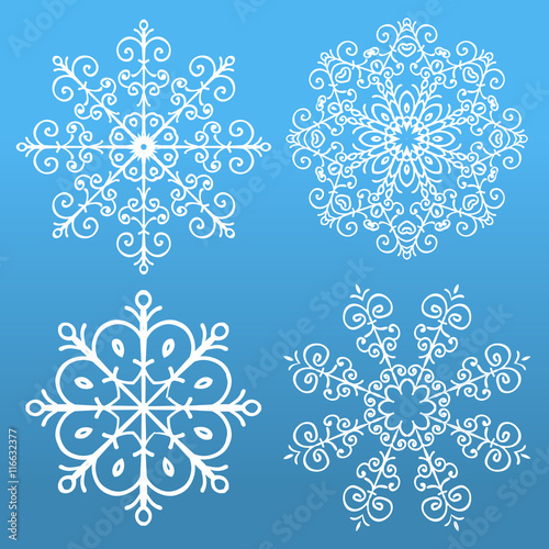 Set of 4 snowflakes on blue background.