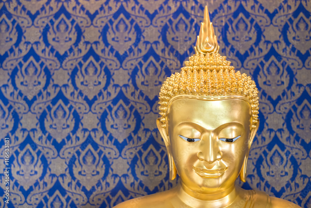 golden budhha statue in blue thai style background