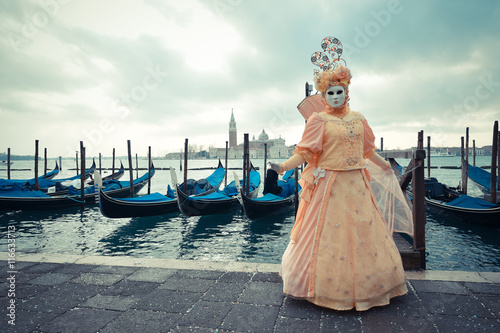 Venetian masked model from the Venice Carnival 2015 with Gondola © Calin Stan