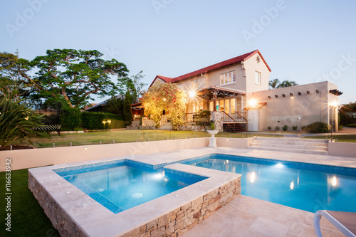 Luxury house garden decoration with a pool side © JRstock