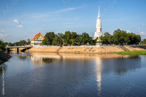 Reflection of white pagoda in Lopburi , Thailand photo