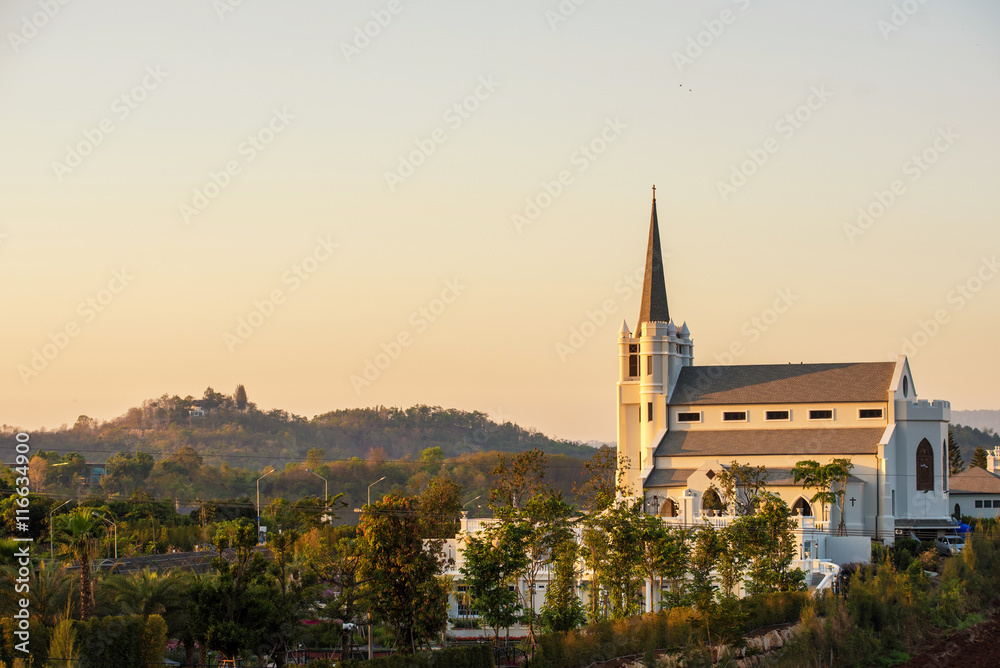beautiful sunrise view of church on a hill