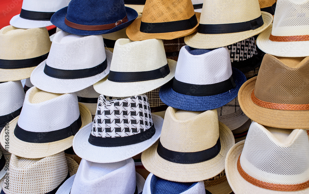 hats in different colors at a market in italy