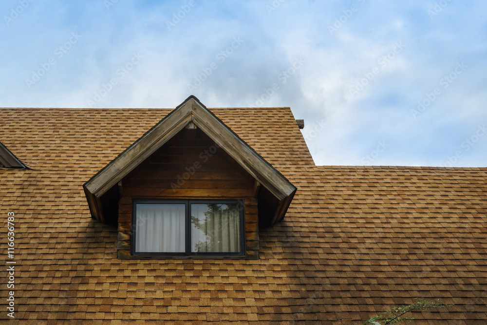 Roof and window of wooden cabin