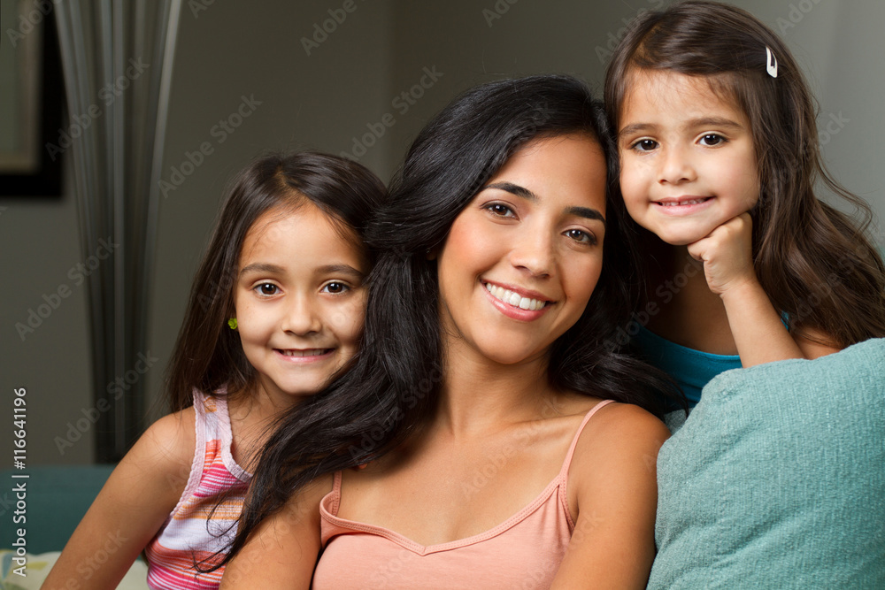 Hispanic mom and her two daughters Hispanic mom and her two daughters