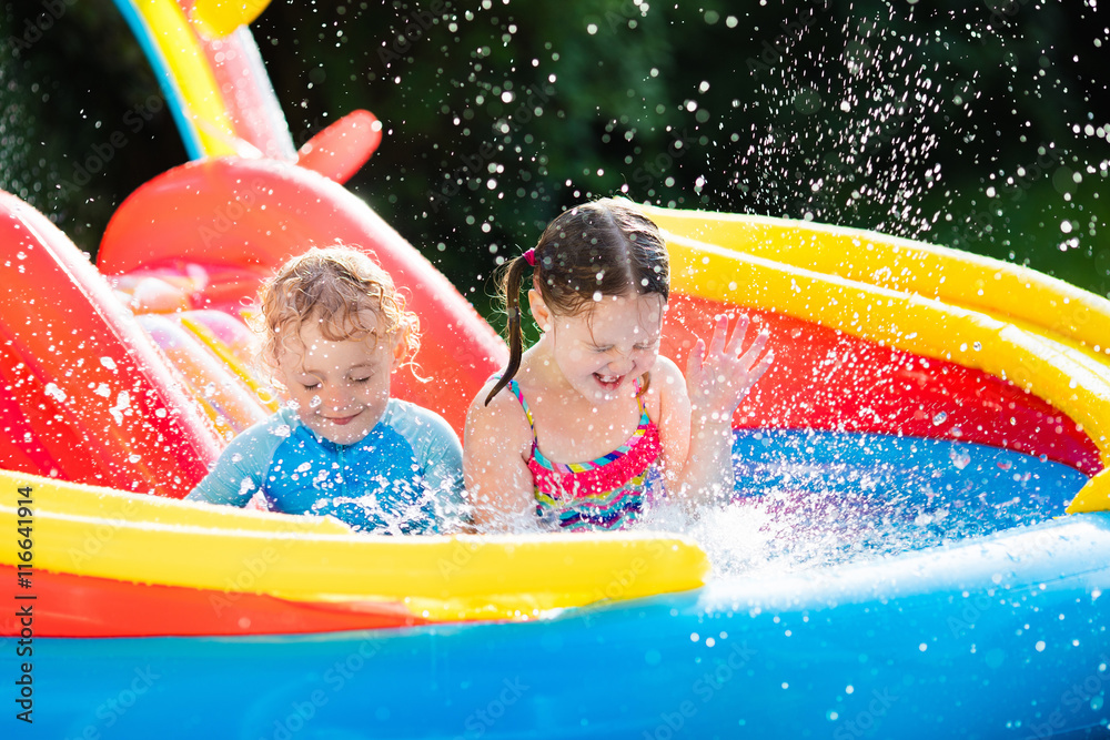 Kids playing in inflatable swimming pool Stock Photo | Adobe Stock