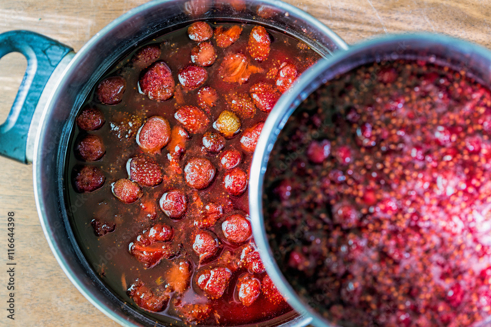 Strawberry and raspberry jam in a saucepan Strawberry and raspberry jam in a saucepan