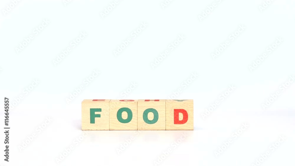 Food word built with wooden cubes on white background. Full word, mixed letters. Related to eating, meal. Stop motion. 4K Ultra HD. Food word built with wooden cubes on white background. Full word, mixed letters. Related to eating, meal. Stop motion. 4K Ultra HD.