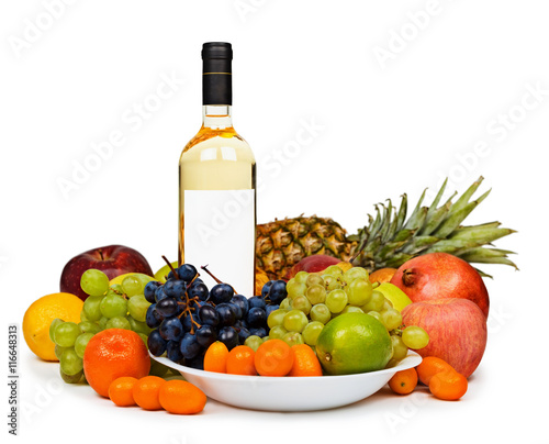Still life - bottle of white wine among fruits on white