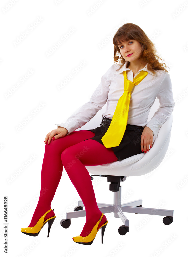Beautiful woman in bright clothes in a chair Beautiful woman in bright clothes in a chair