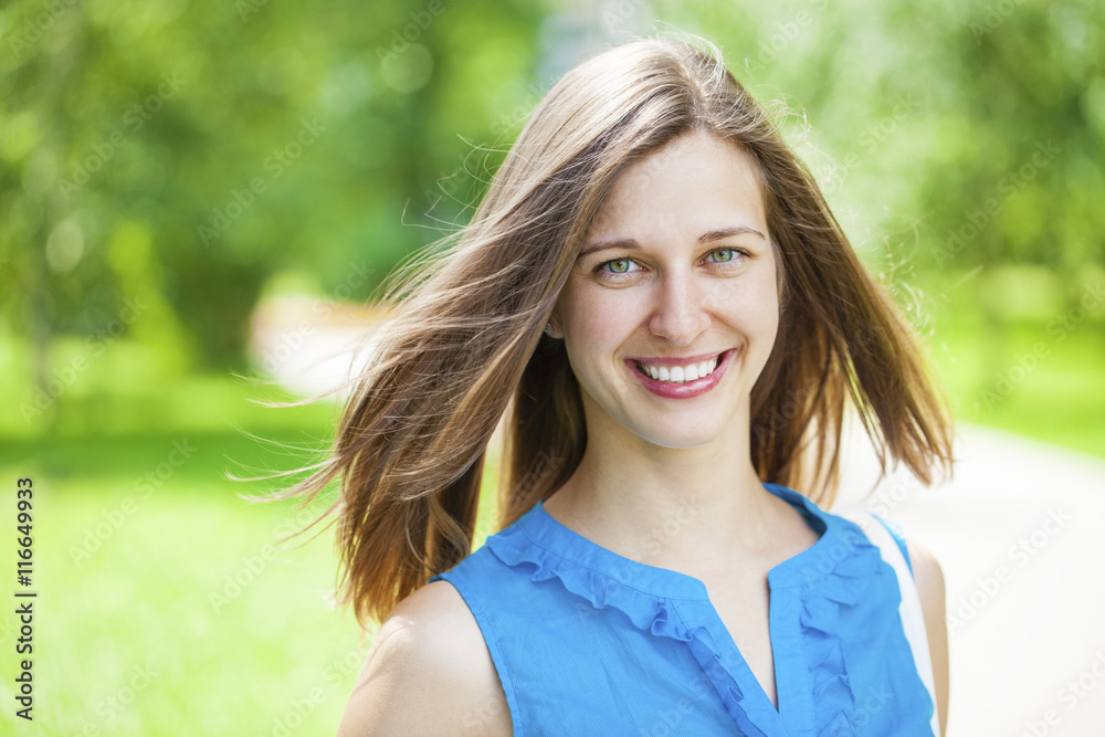 Naklejka premium Portrait of beautiful young happy woman