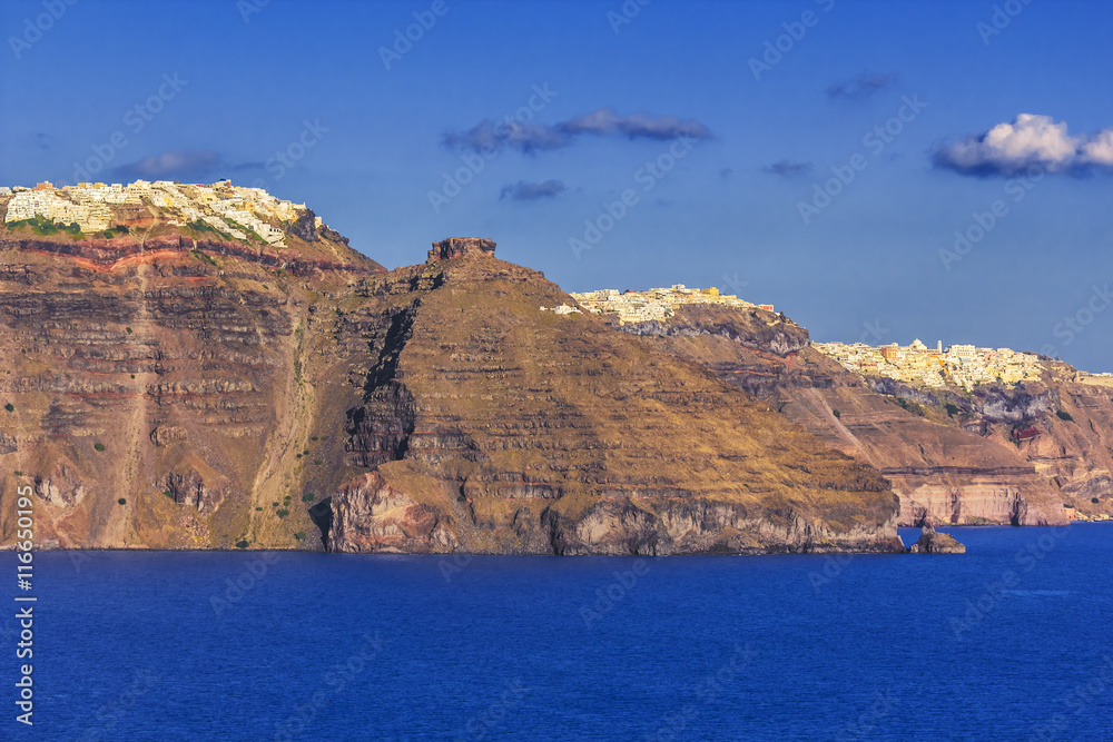 Greece. Cyclades Islands, panoramic view of Santorini (Thira, Thera) and villages built on the edge of the caldera (in order: Imerovigli, Skaros Rock, Firostefani settlement and capital town - Fira)