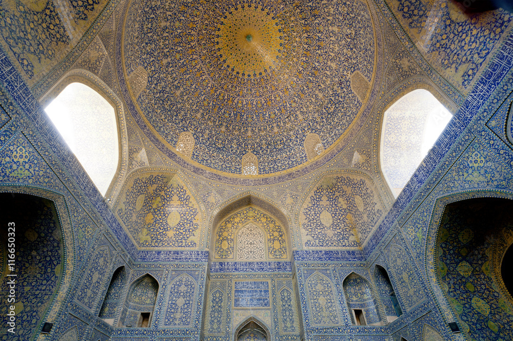 Patterned arches and huge dome inside the ancient persian mosque