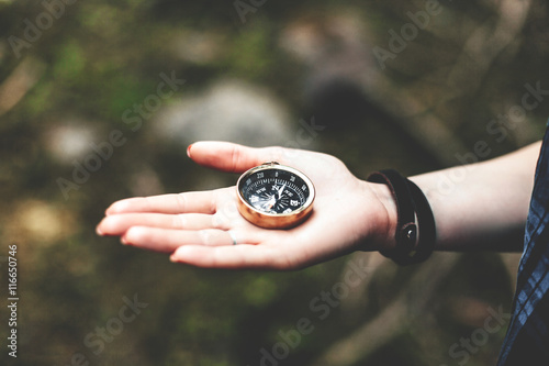 Man holding a compass.The concept of navigation, leisure.