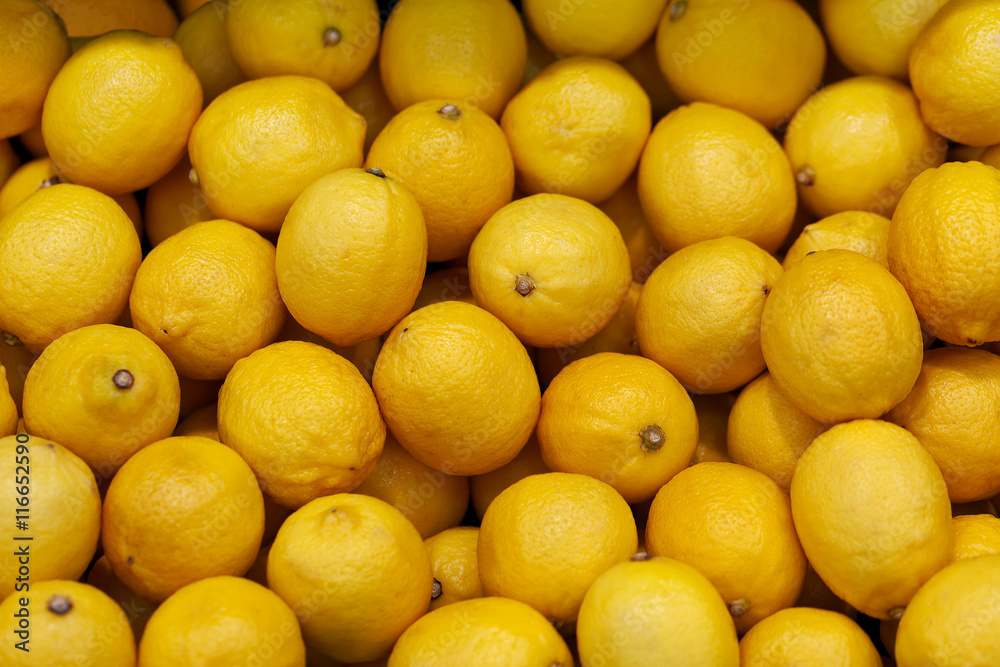 Lemons on the market counter - background
