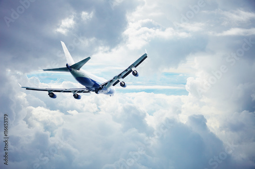 Airliner flying through the thick clouds