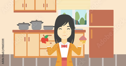 Woman choosing between apple and cupcake.