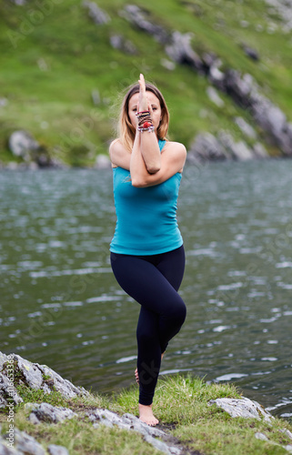Young woman practicing yoga outdoor