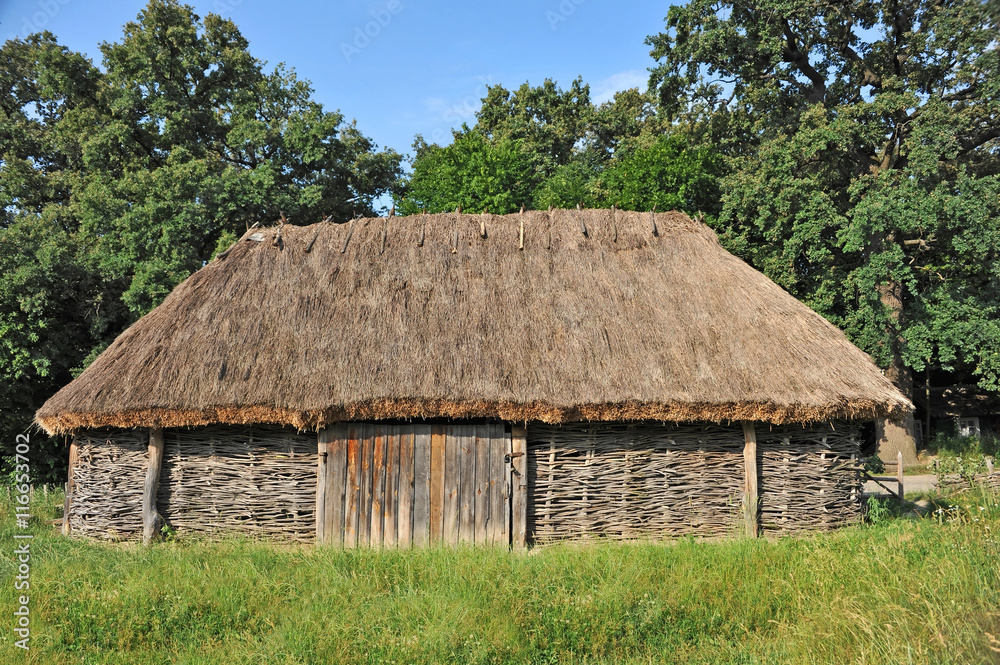 Ancient barn with a straw roof